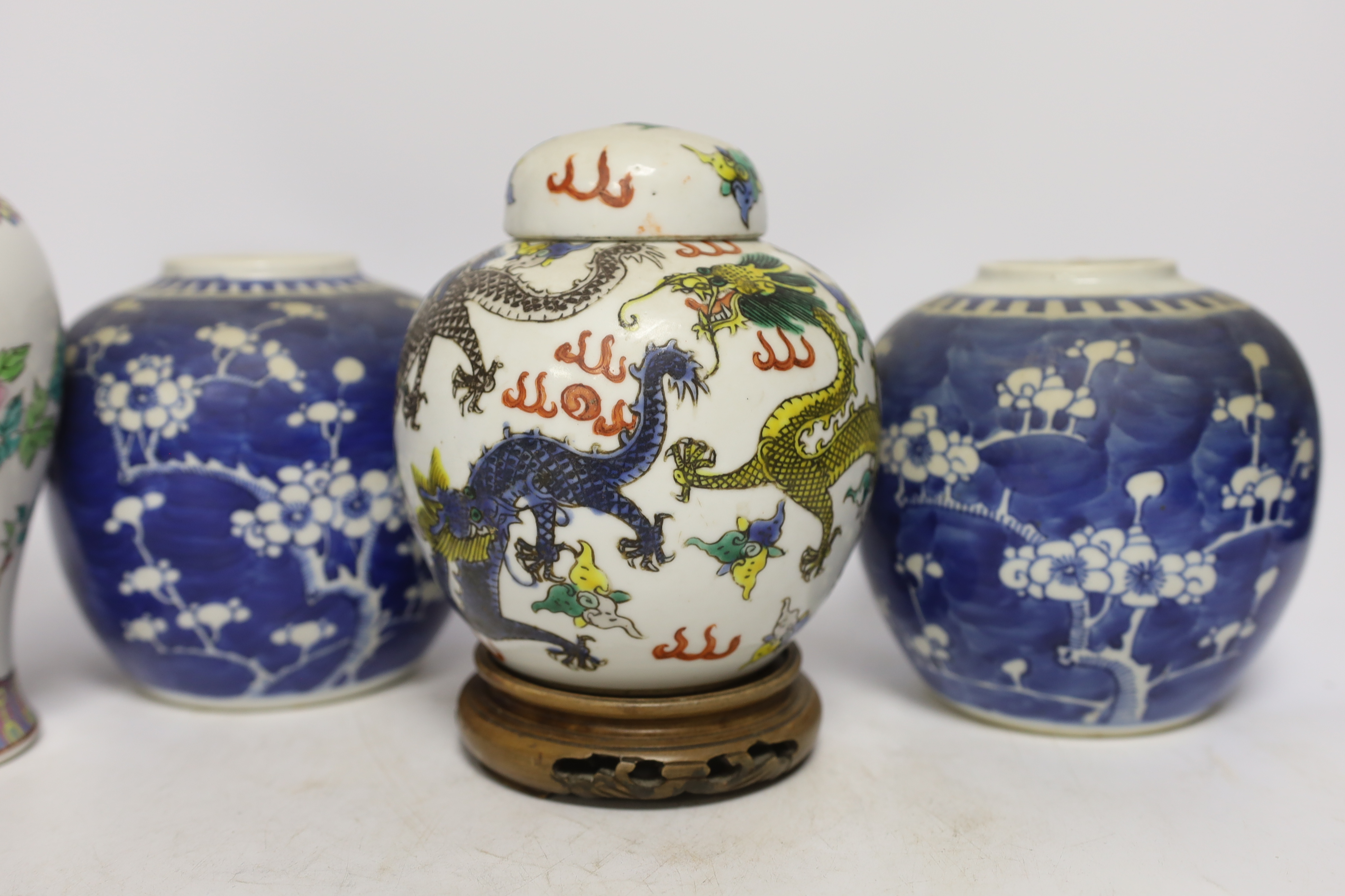 Four Chinese items; a pair of prunus another and a famille rose vase, tallest 20.5cm high